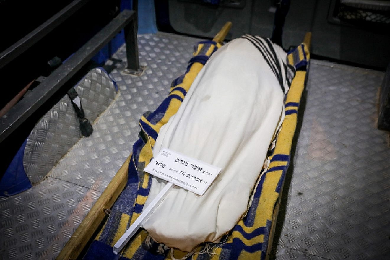 The body of Asher Menachem Paley, 7, is seen at his funeral in Jerusalem, Feb. 11, 2023. Photo by Noam Revkin Fenton/Flash90.