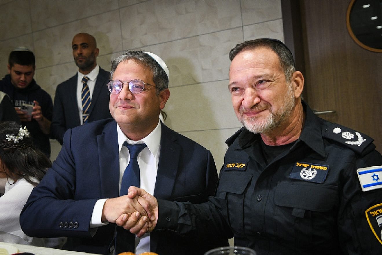 Otzma Yehudit Party head MK Itamar Ben-Gvir and Israel Police Commissioner Yaakov Shabtai at Ben-Gvir's daughter's bat mitzvah in Kiryat Arba, Dec. 8, 2022. Photo by Arie Leib Abrams/Flash90.