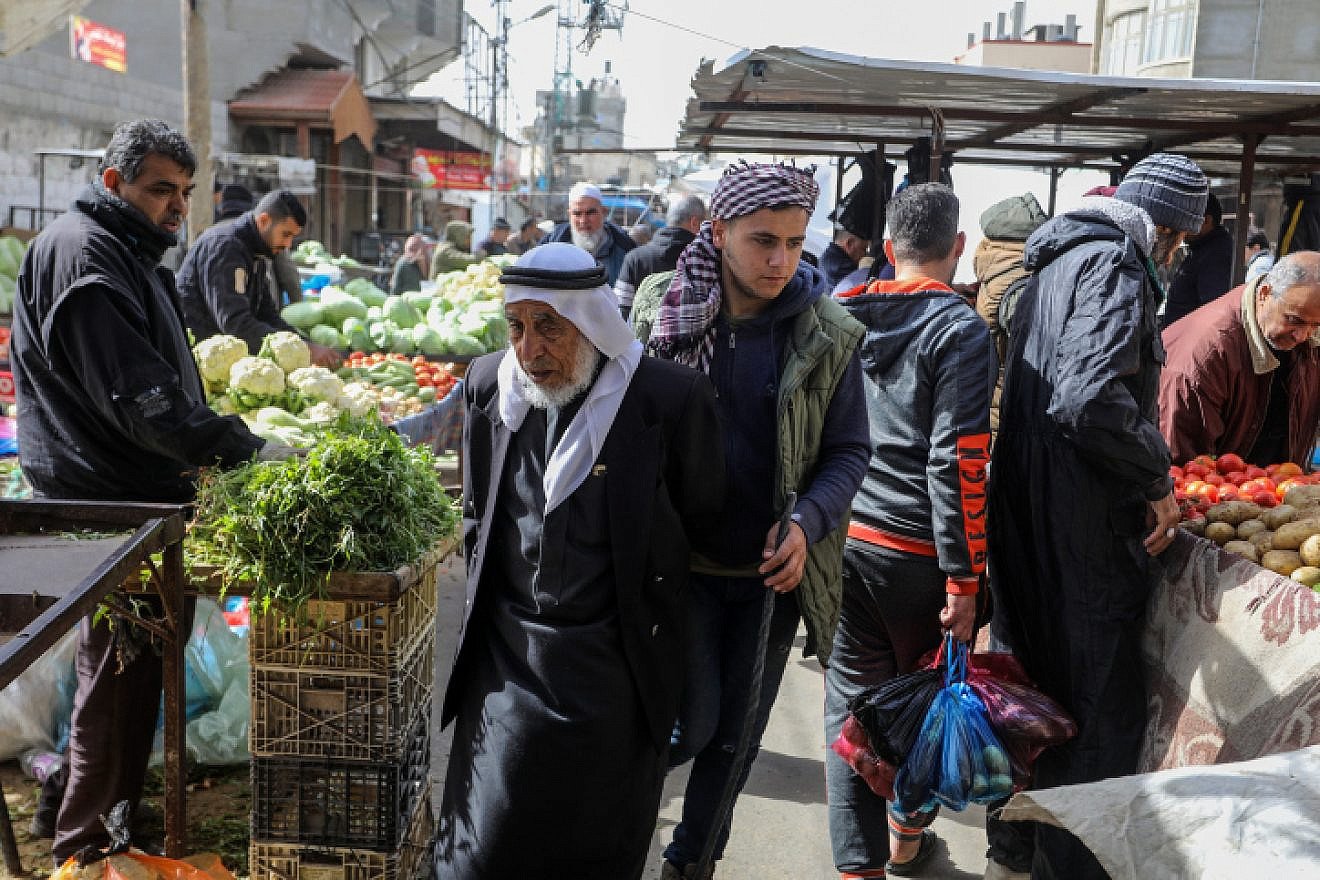 Palestinians shop in the market in Rafah, in the southern Gaza Strip, on February 1, 2022. Photo by Abed Rahim Khatib/Flash90/