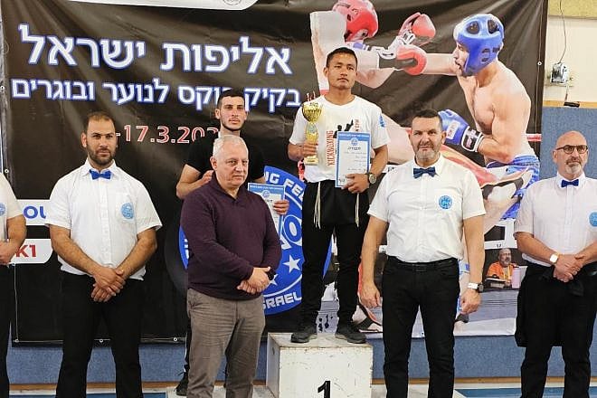 Obed Hrangchal stands in the champion's spot at the national tournament in Kfar Yasif, the Western Galilee, March 17, 2023. Courtesy.
