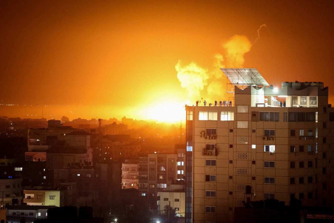 Flames rise above buildings in the Hamas-ruled Gaza Strip after Israel conducts airstrikes in response to rocket fire, April 6, 2023. Photo by Atia Mohammed/Flash90.