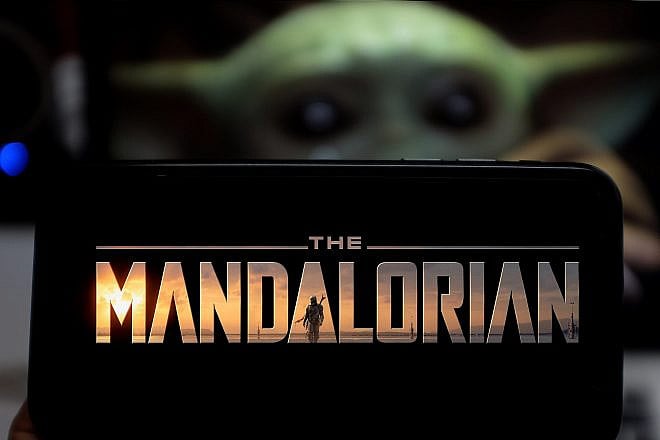 “The Mandalorian” logo smartphone based on a web television series. United States, Jan. 18, 2020. Credit: Daniel Constante/Shutterstock.