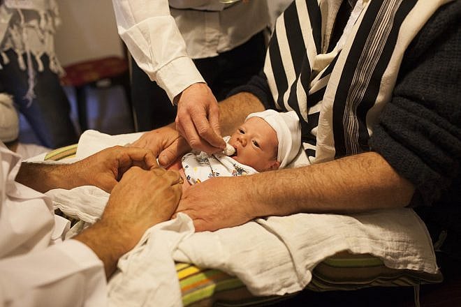 Jews perform a “brit milah,” or ritual circumcision, in Jerusalem on Dec. 12 , 2011. Photo by Yonatan Sindel/Flash90.