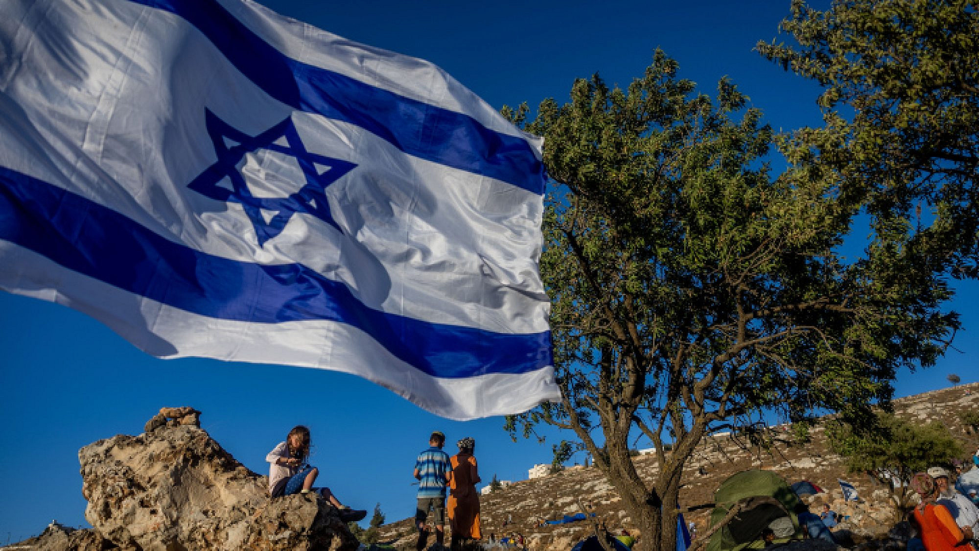 Members of the Nachala Settlement Movement near Kiryat Arba in Judea, July 20, 2022. Photo by Yonatan Sindel/Flash90.