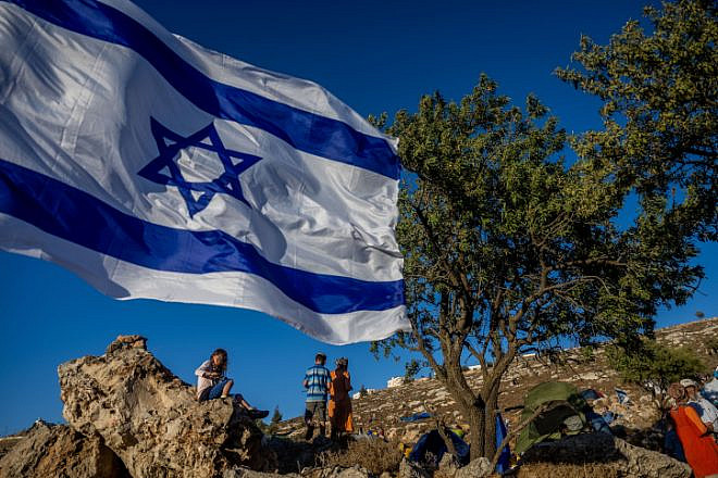 Members of the Nachala Settlement Movement near Kiryat Arba in Judea, July 20, 2022. Photo by Yonatan Sindel/Flash90.