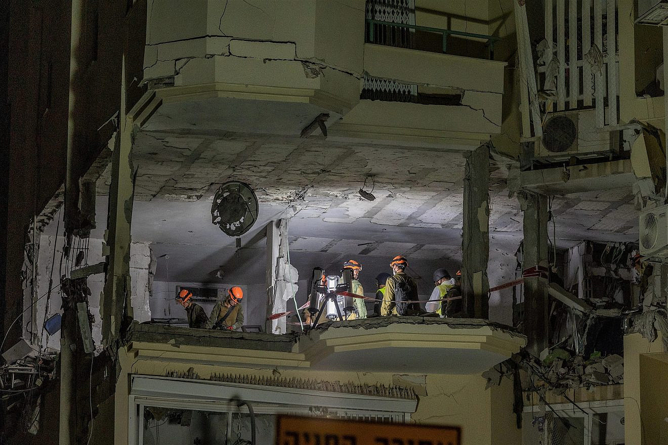 Police and rescue forces at the scene where a rocket fired from the Palestinian Islamic Jihad terror group in the Gaza Strip hit and damaged a house in Rehovot on May 11, 2023. Photo by Yossi Aloni/Flash90.
