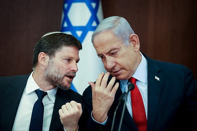 Israeli Finance Minister Bezalel Smotrich speaks with Israeli Prime Minister Benjamin Netanyahu at a Cabinet meeting at the Prime Minister's Office in Jerusalem, on June 18, 2023. Photo by Amit Shabi/POOL.