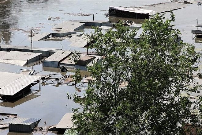 Settlements on the left bank of Dnieper River remain underwater after the Kakhovka Dam was breached on June 6, 2023. Credit: Armyinform via Wikimedia Commons.