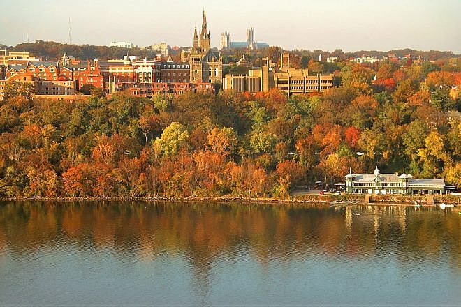 Georgetown University's main campus. Washington National Cathedral is visible above campus, and the Washington Canoe Club is in the lower right on the Potomac River. Credit: Patrickneil via Wikimedia Commons.