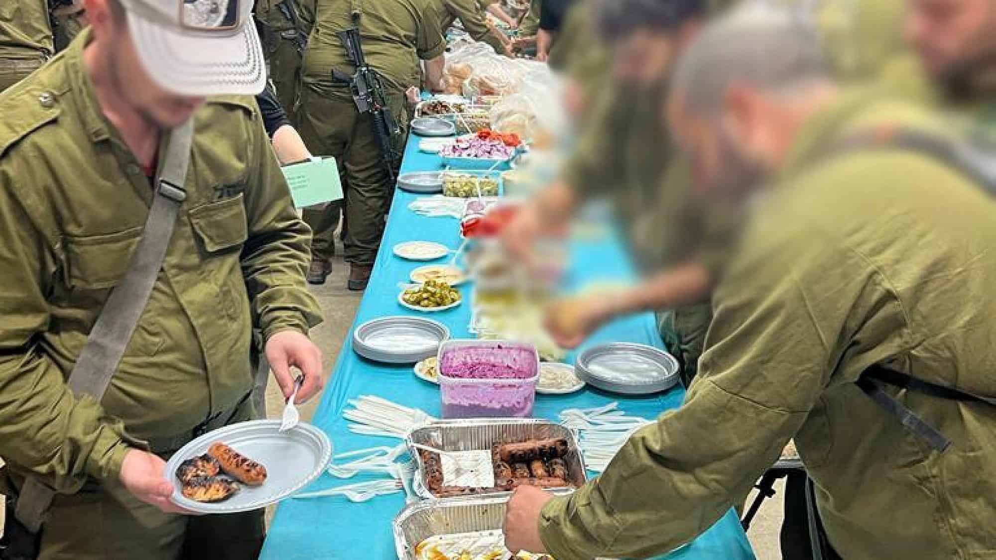Soldiers dig in at a Grilling for IDF shindig. Credit: Courtesy.