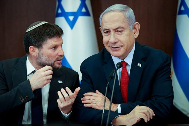 Israeli Finance Minister Bezalel Smotrich speaks with Israeli Prime Minister Benjamin Netanyahu during a Cabinet meeting in Jerusalem, on June 18, 2023. Photo by Amit Shabi/POOL.
