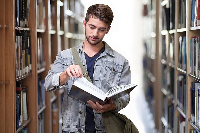 (Illustrative) Student with book. Credit: Pixabay.
