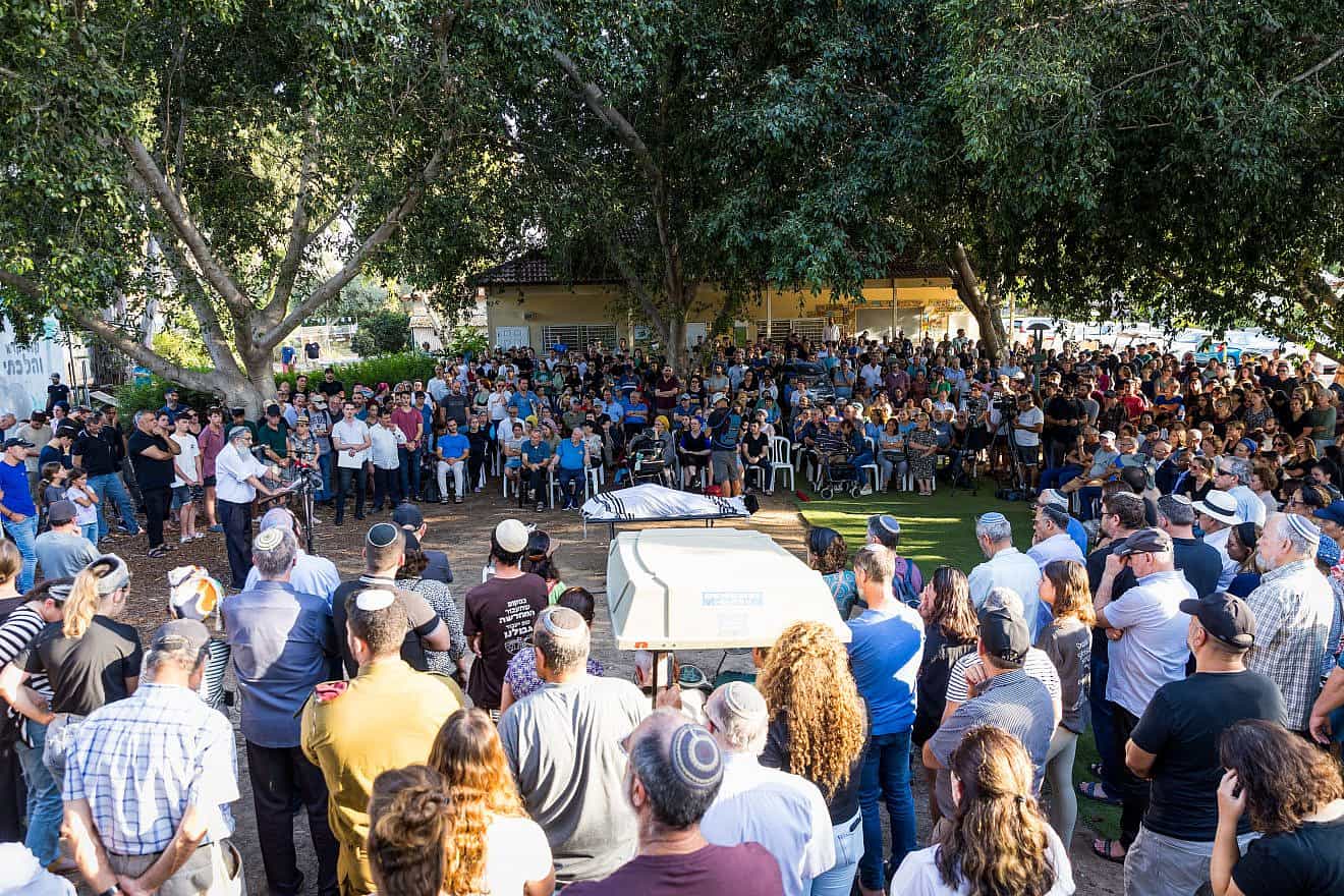 Relatives and friends attend the funeral of Holocaust survivor David (“Dugo”) Leitner in Moshav Nir Galim in Israel on July 27, 2023. Photo by Liron Moldovan/Flash90.