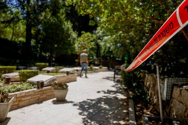Police marking tape at Mount Herzl Military Cemetery, in Jerusalem, on June 30, 2023, where a letter threatening Israeli Prime Minister Benjamin Netanyahu found on the grave of his brother, Yoni Netanyahu earlier in the day. Photo by Flash90