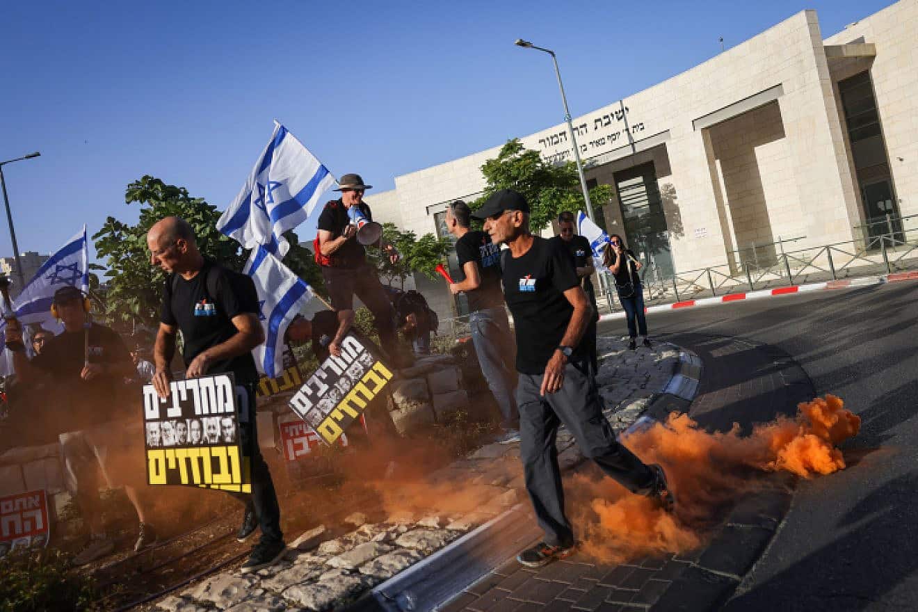 Activists protest against the government's planned judicial overhaul, outside Har Hamor Yeshiva in Har Homa, Jerusalem, on July 5, 2023. Photo by Chaim Goldberg/Flash90.