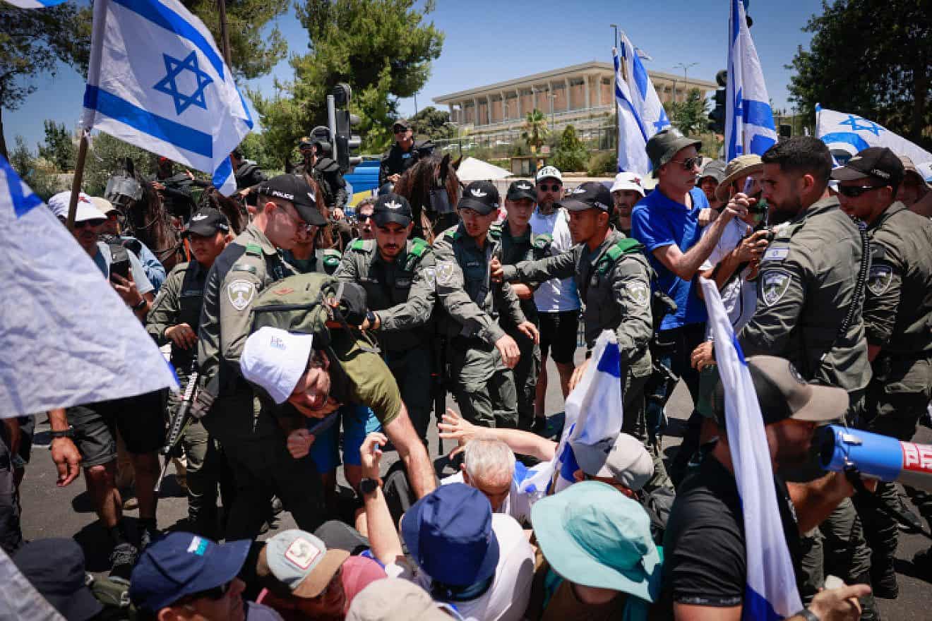 Anti-overhaul activists block a road during a protest against the government's judicial overhaul near the Knesset in Jerusalem, on July 24, 2023. Photo by Chaim Goldberg/Flash90.