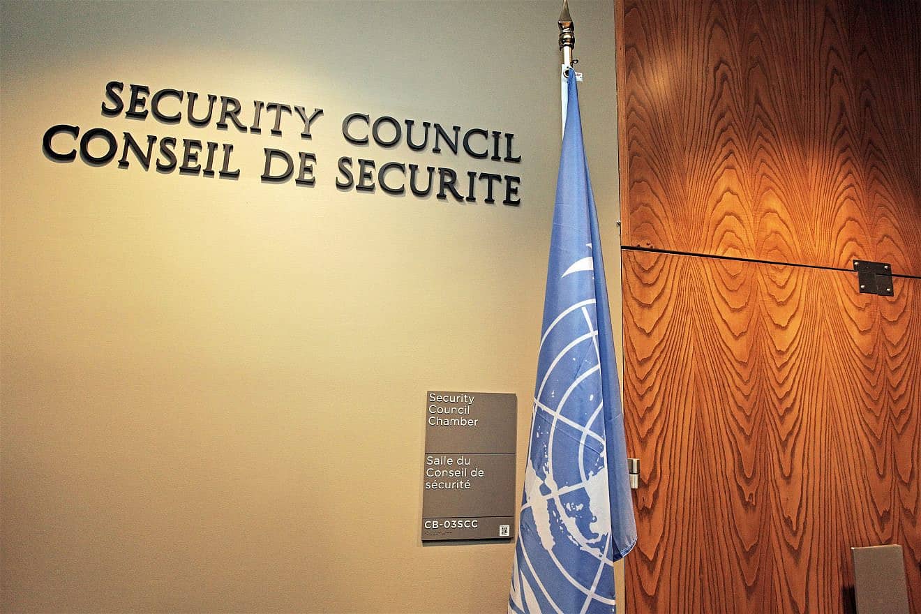 The Security Council Chamber's door of the U.N. headquarters building with the U.N. flag. Credit: christianthiel.net/Shutterstock.