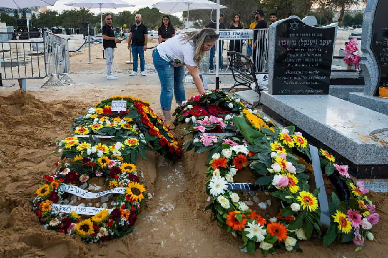 The graves of Shay Silas Nigreke and his son Aviad Nir, who were murdered in Huwara on Saturday, Aug/ 20, 2023. Photo by Flash90.