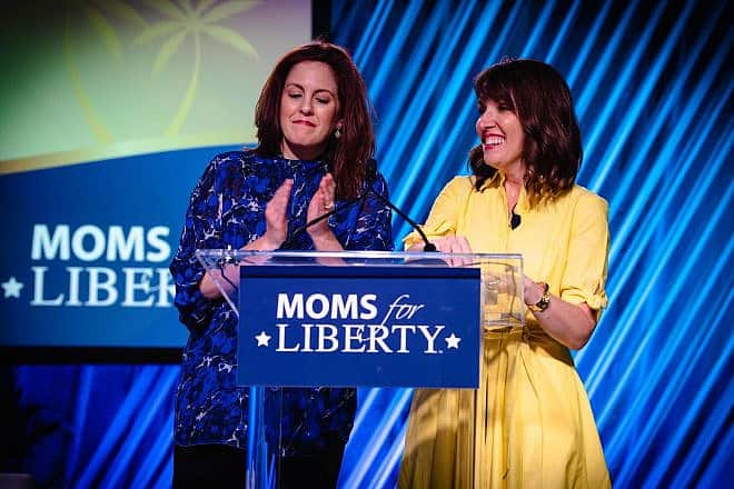 Moms for Liberty cofounders Tiffany Justice (left) and Tina Descovich speak at the parents-rights group's 2022 summit. Credit: Moms for Liberty.