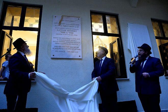 Community members unveil a plaque at the reopening of the Ohel Ezster synagogue in Budapest, Sept. 5, 2023. Photo by Zsolt Demecs.