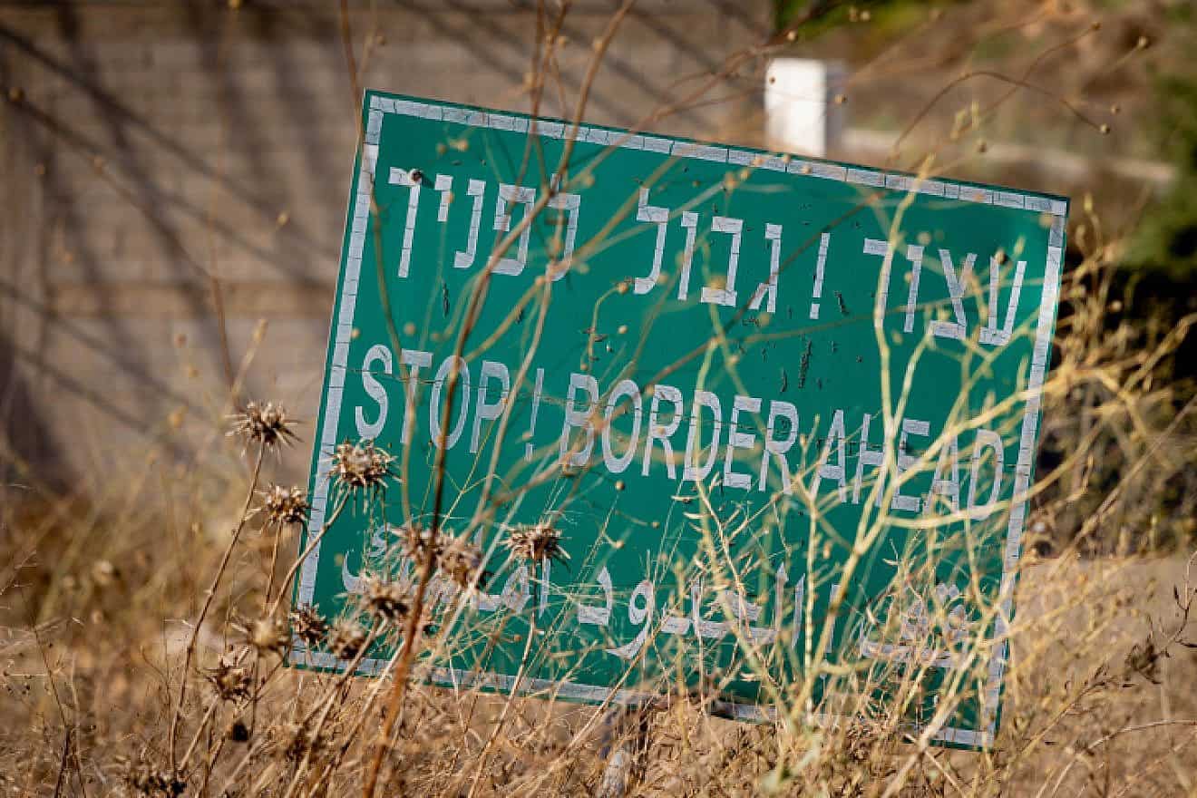 A sign reads "Stop! Border ahead" near the border between Israel and Lebanon, Aug. 10, 2023. Photo by Chaim Goldberg/Flash90.