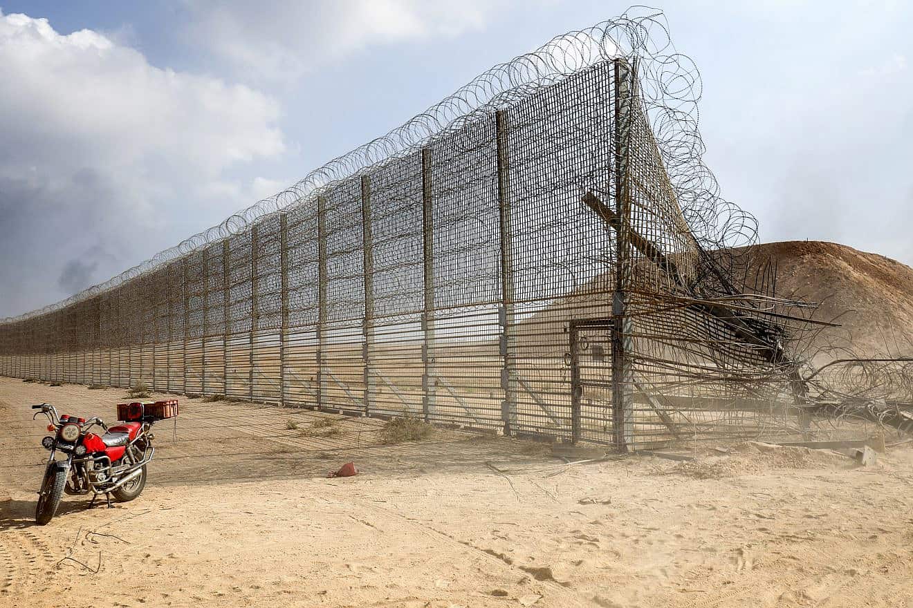 Gazans take control of an Israeli tank after crossing the border fence with Israel, Oct. 7, 2023. Photo by Abed Rahim Khatib/Flash90.