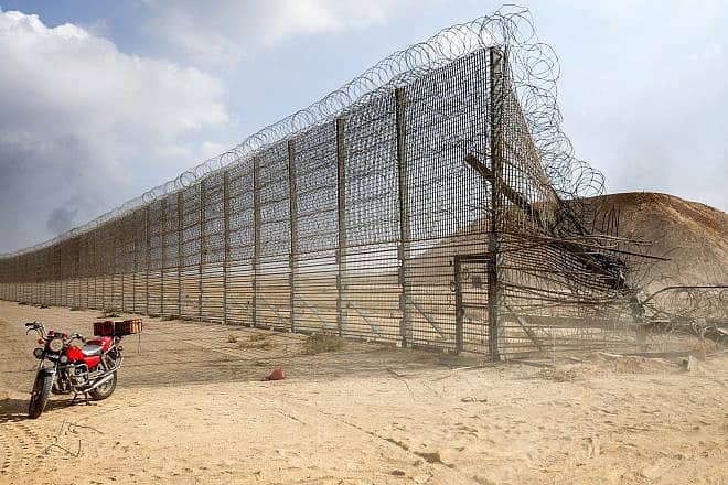 Gazans take control of an Israeli tank after crossing the border fence with Israel, Oct. 7, 2023. Photo by Abed Rahim Khatib/Flash90.