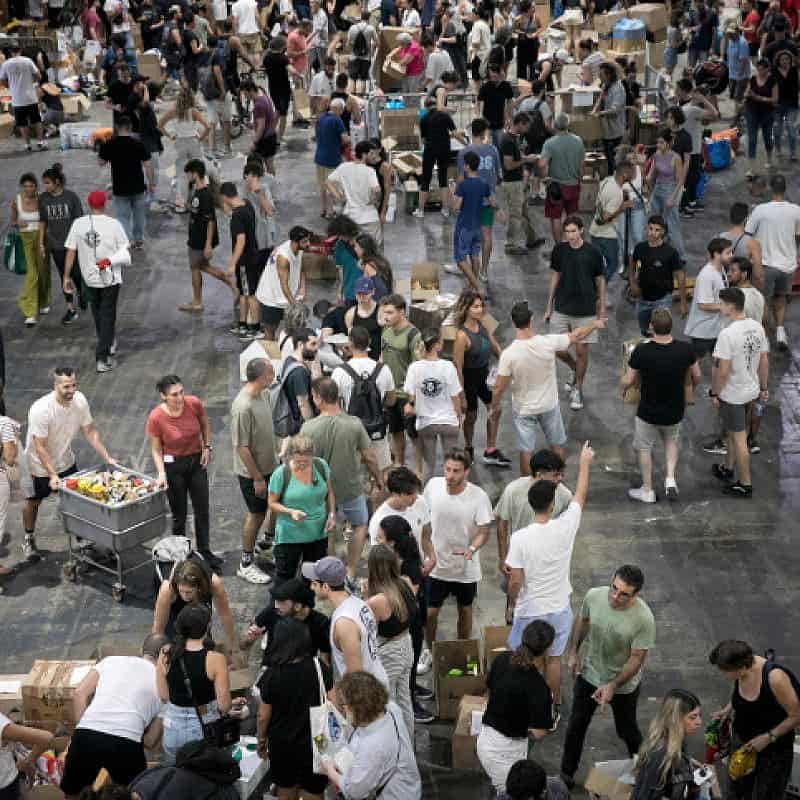 Israeli citizens pack donations of food and other necessities for Israeli soldiers and citizens in the south, in Tel Aviv, Oct. 9, 2023. Photo by Miriam Alster/Flash90.