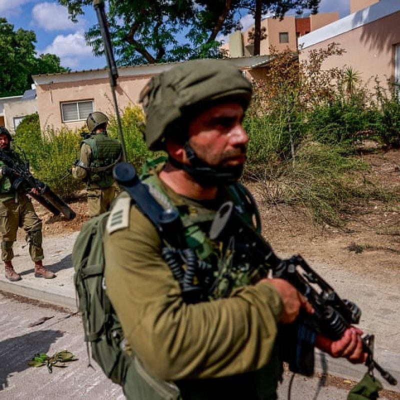 Israeli soldiers in Kibbutz Kfar Aza, near the Israeli-Gaza border in southern Israel, Oct. 10, 2023. Photo by Chaim Goldberg/Flash90.