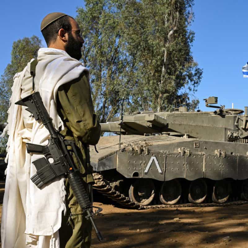An Israeli soldier recites morning prayers near the border with Lebanon, Oct. 25, 2023. Photo by Michael Giladi/Flash90.