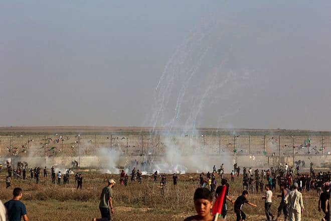 Palestinians riot at the Israeli border fence, east of Gaza City on Aug. 21, 2023. Photo by Atia Mohammed/Flash90.