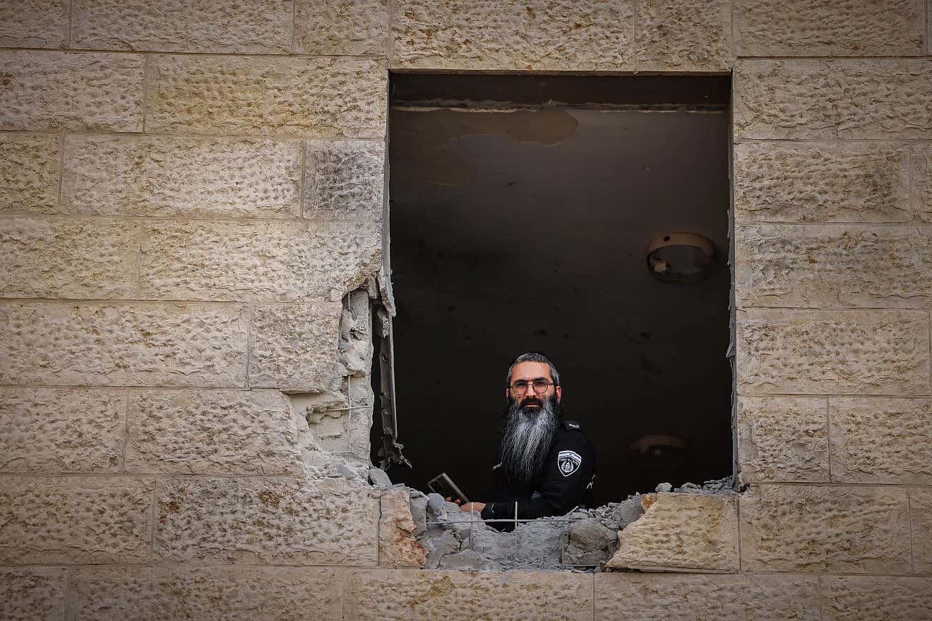 Israeli security forces at the scene where a rocket fired from Hamas the Gaza Strip hit and caused damage in the southern Israeli city of Sderot, Oct. 23, 2023. Photo by Chaim Goldberg/Flash90.
