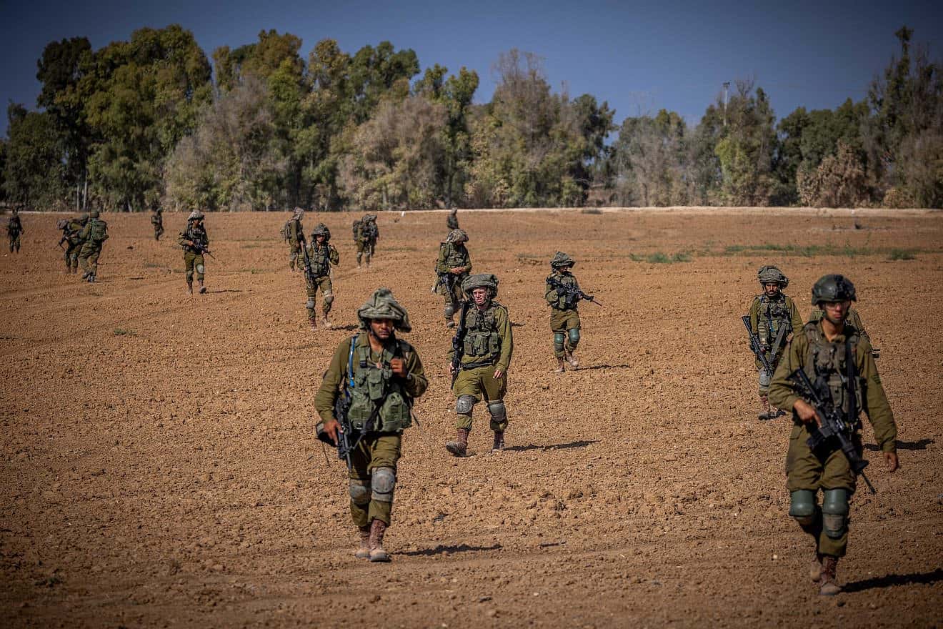 Israeli soldiers from the Netzach Yehuda Battalion patrol near the border with the Gaza Strip, Oct. 20, 2023. Photo by Yonatan Sindel/Flash90.