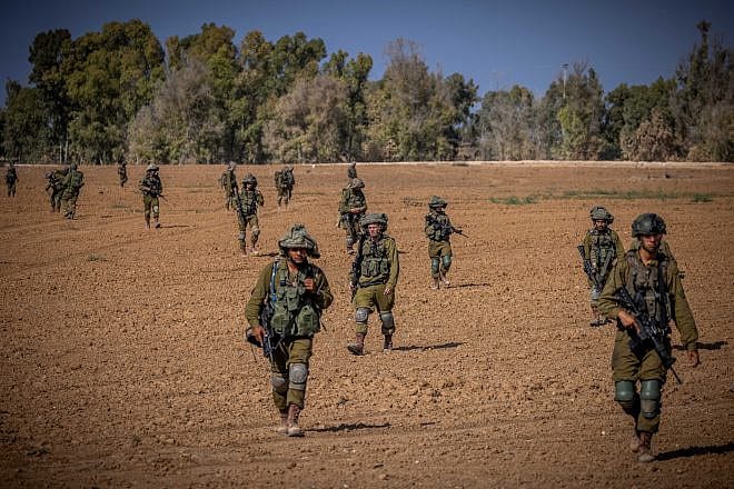 Israeli soldiers from the Netzah Yehuda Battalion patrol near the border with the Gaza Strip, Oct. 20, 2023. Photo by Yonatan Sindel/Flash90.