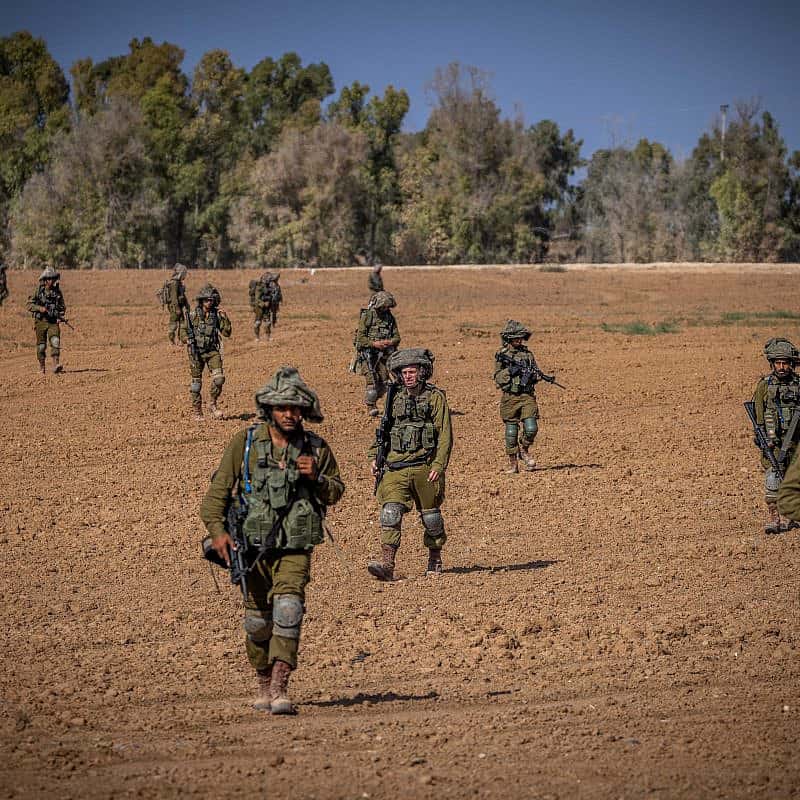 Israeli soldiers from the Netzach Yehuda Battalion patrol near the border with the Gaza Strip, Oct. 20, 2023. Photo by Yonatan Sindel/Flash90.