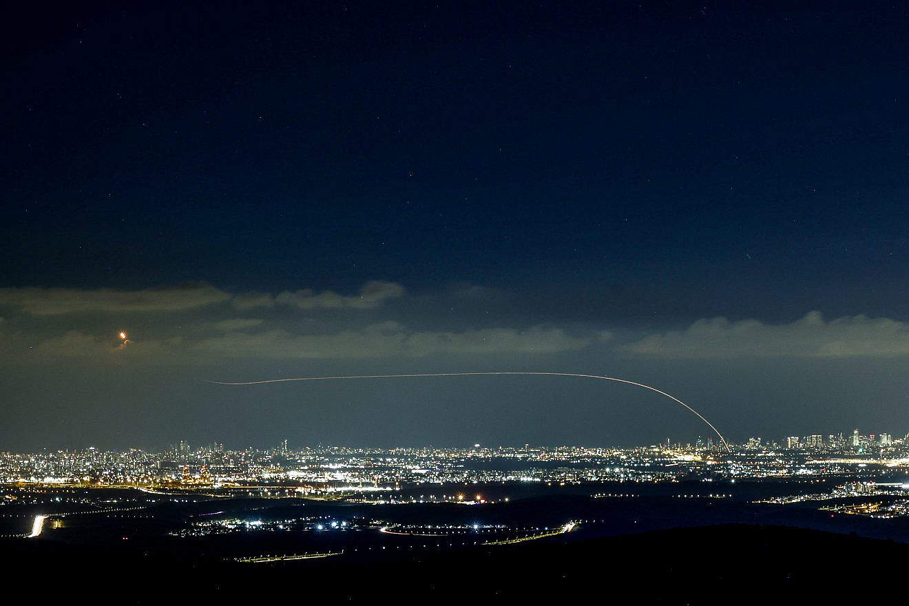 The Iron Dome air-defense system fires interceptor missiles at rockets fired from the Gaza Strip at Israel, as seen from Moshav Neve Ilan, west of Jerusalem, on Oct. 18, 2023. Photo by Chaim Goldberg/Flash90.