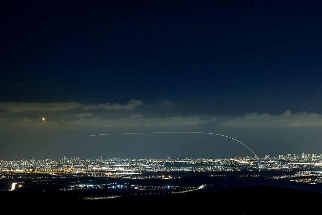 The Iron Dome air-defense system fires interceptor missiles at rockets fired from the Gaza Strip at Israel, as seen from Moshav Neve Ilan, west of Jerusalem, on Oct. 18, 2023. Photo by Chaim Goldberg/Flash90.