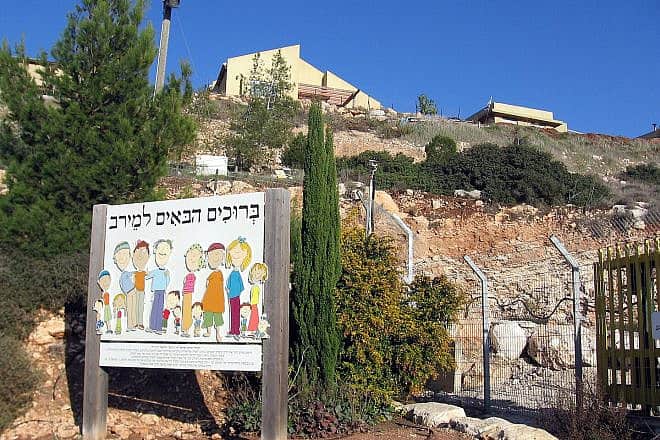 The entrance to Kibbutz Meirav in Israel, six miles southwest of Beit She'an. Source: Wikimedia Commons.