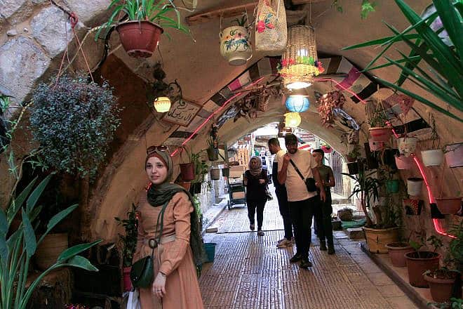 Muslims prepare decorations and sweets to commemorate the birth of the prophet Muhammad, in the Old City (the "Casbah") of Nablus in Samaria, Sept. 26, 2023. Photo by Nasser Ishtayeh /Flash90.