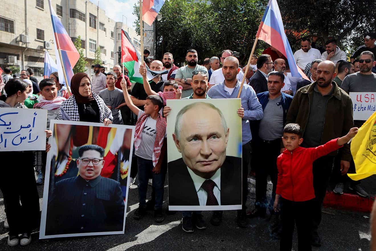 Palestinians in Hebron protest on behalf of their brethren in the Gaza Strip, with posters of Russian President Vladimir Putin and North Korean leader Kim Jong-un, following Hamas's Oct. 7 massacre of Israelis, Oct. 20, 2023. Photo by Wisam Hashlamoun/Flash90.