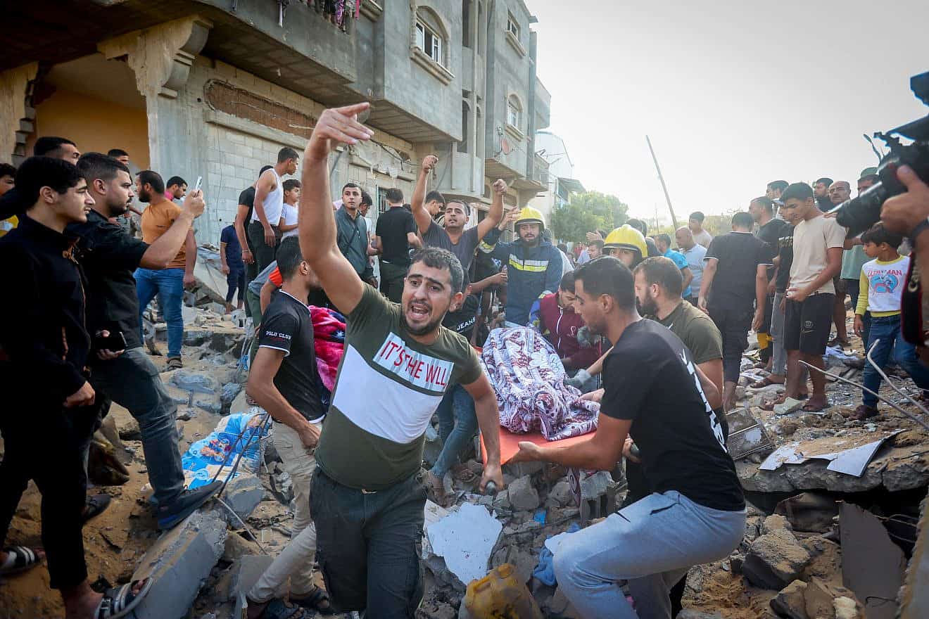 Palestinians look for survivors after an Israeli airstrike in Khan Yunis in the southern Gaza Strip, on Oct. 16, 2023. Photo by Atia Mohammed/Flash90.