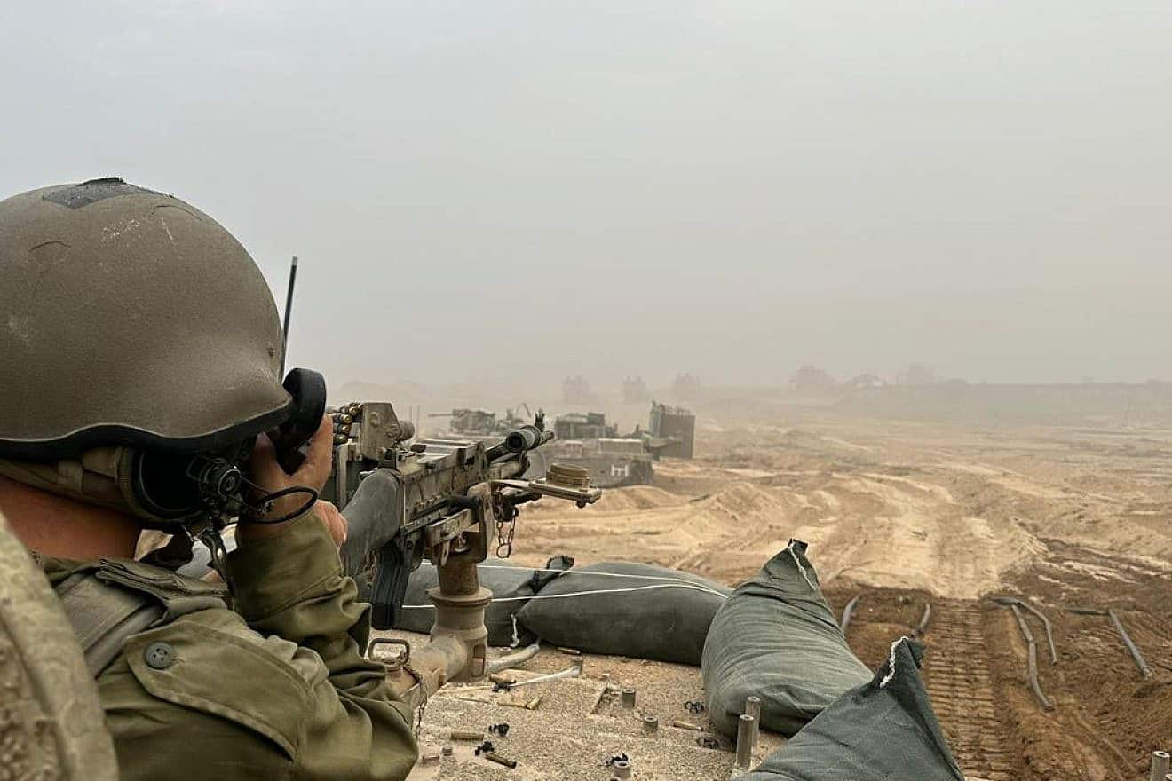 An Israeli soldier on a tank during expanded ground activities in the Gaza Strip. Credit: IDF.