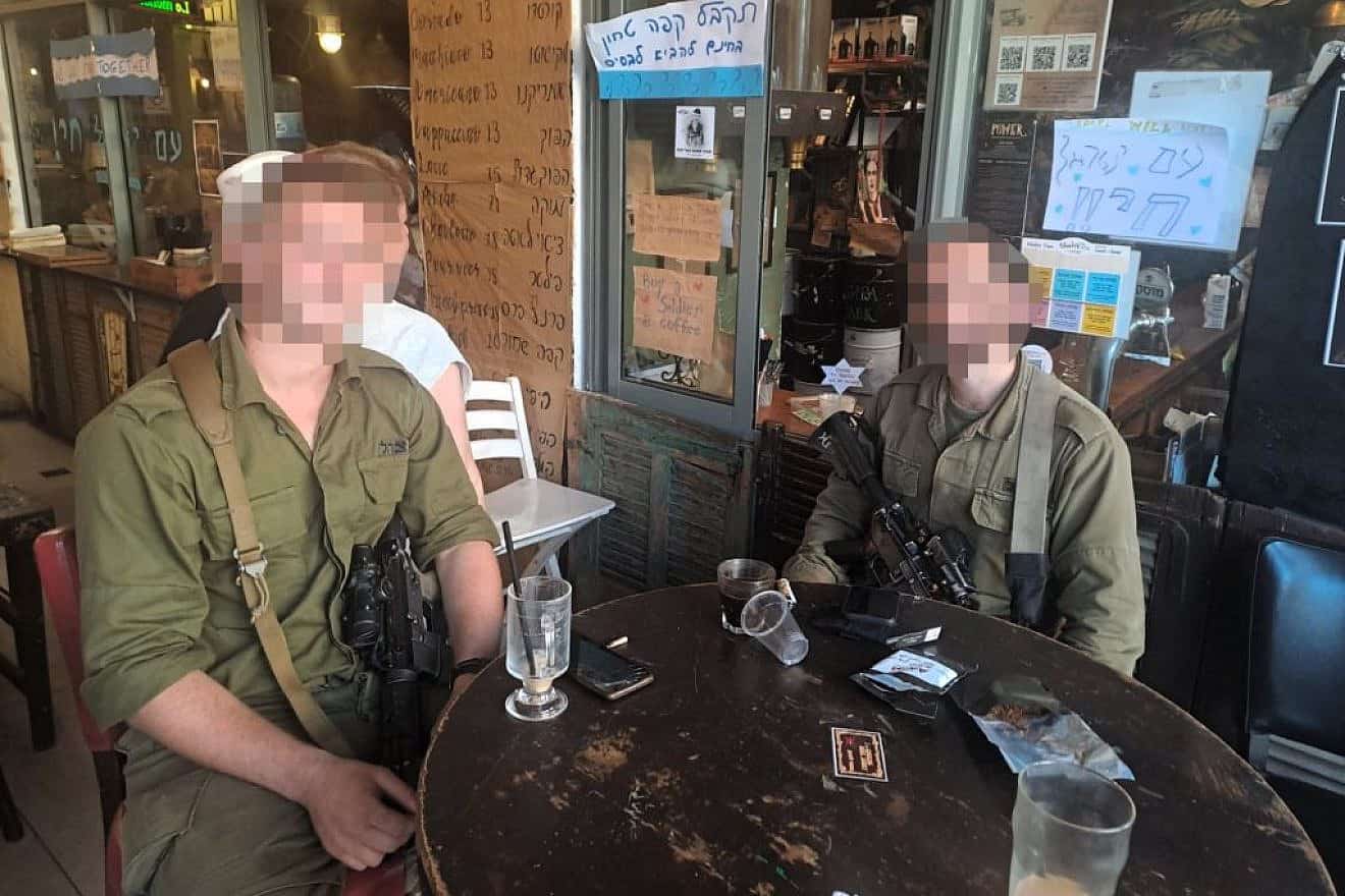 D. and L., members of an elite IDF unit that fought in the battle of Kibbutz Be'eri, sharing their story in Jerusalem on Oct. 23, 2023. Photo by Gil Tannenbaum/TPS.