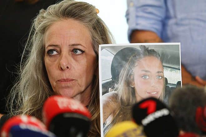 Keren Shem holds a photo of her daughter Mia, who is being held hostage in Gaza, at a press conference in Tel Aviv, Oct. 17, 2023. Photo by Gideon Markowicz/TPS.