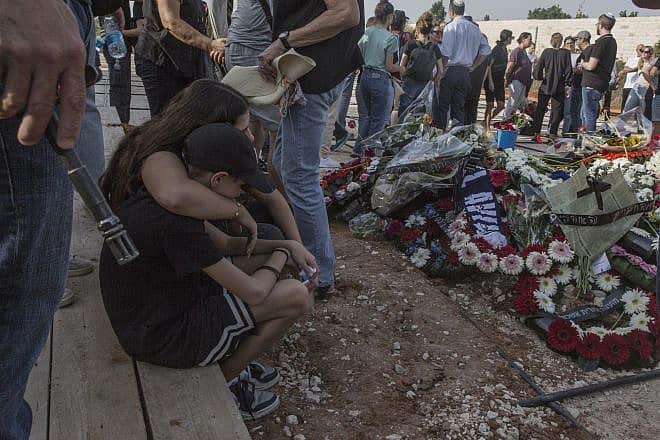 Members of the Cohen family mourn at a cemetery near Petach Tikvah, on Oct. 22, 2023. Three generations of the family were murdered by Hamas terrorists in Kibbutz Be'eri in southern Israel on Oct. 7, 2023. Photo by Rina Castelnuovo.