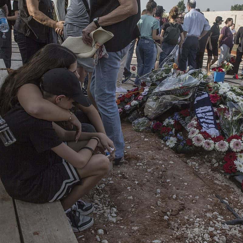 Members of the Cohen family mourn at a cemetery near Petach Tikvah, on Oct. 22, 2023. Three generations of the family were murdered by Hamas terrorists in Kibbutz Be'eri in southern Israel on Oct. 7, 2023. Photo by Rina Castelnuovo.