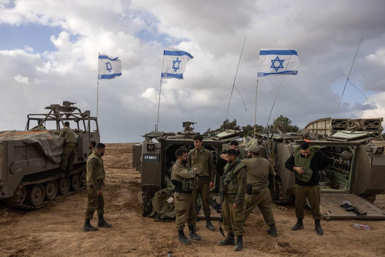 Israeli soldiers and armored personnel carriers near the Gaza border, Nov. 20, 2023. Photo by Chaim Goldberg/Flash90.