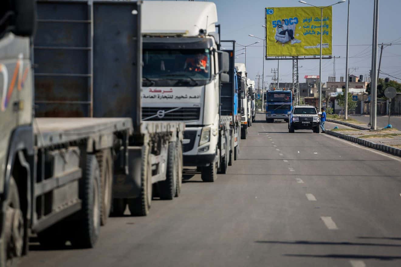 Trucks with humanitarian aid for Palestinian civilians arrive at the Gaza side of the Rafah border crossing with Egypt, Oct. 21, 2023. Photo by Atia Mohammed/Flash90.