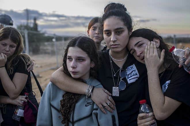 Friends of Liel and Yanai Hetzroni attend their funeral at Kibbutz Revivim, Nov. 15, 2023. Photo by Rina Castelnuovo.