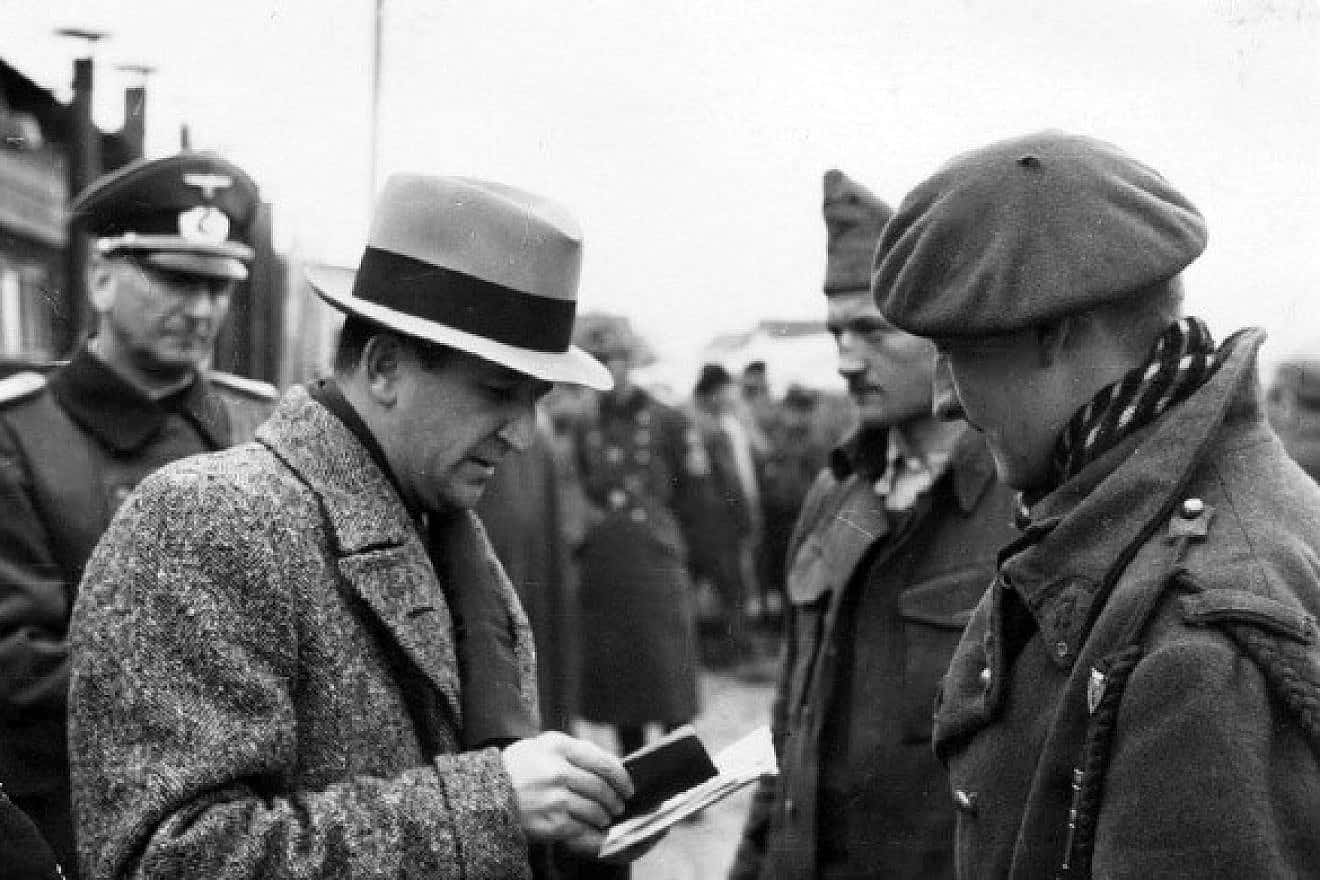 Marcel Junod, a delegate and member of the International Committee of the Red Cross, visits POWs in Germany during World War II. Credit: Wikimedia Commons.